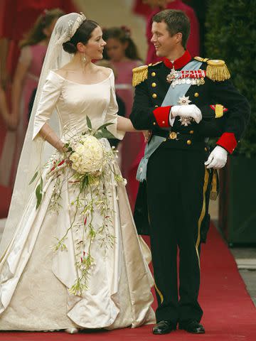 <p>SVEN NACKSTRAND/AFP/Getty</p> Prince Frederik and Princess Mary Elizabeth Donaldson walk out of the Copenhagen Cathedral on May 14, 2004.