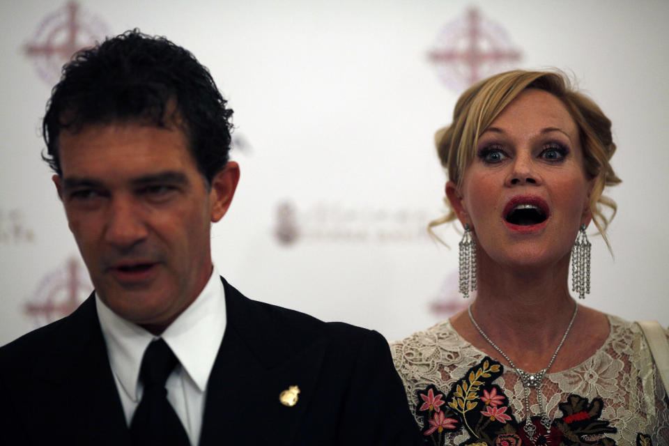 Spanish actor and director Antonio Banderas and his wife actress Melanie Griffith pose for photographers during a photocall before he declares this year's Malaga Holy Week open with a traditional speech known as the "Pregon" at Cervantes Theatre in Malaga, southern Spain April 9, 2011. Hundreds of Easter processions will take place around the clock in Spain during Holy Week from April 17-24. REUTERS/Jon Nazca (SPAIN - Tags: ENTERTAINMENT RELIGION)