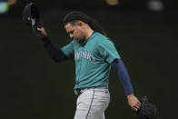 Seattle Mariners starter Luis Castillo walks back to the dugout after a pitching change during the seventh inning of a baseball game against the Minnesota Twins, Monday, May 6, 2024, in Minneapolis. (AP Photo/Abbie Parr)