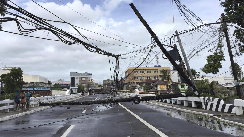 Electrical poles are toppled due to strong winds from Typhoon Goni in Daet, Camarines Norte province, central Philippines, Sunday Nov. 1, 2020. The super typhoon slammed into the eastern Philippines with ferocious winds early Sunday and about a million people have been evacuated in its projected path, including in the capital where the main international airport was ordered closed. (AP Photo/Sharalaine Robles Gonzales)