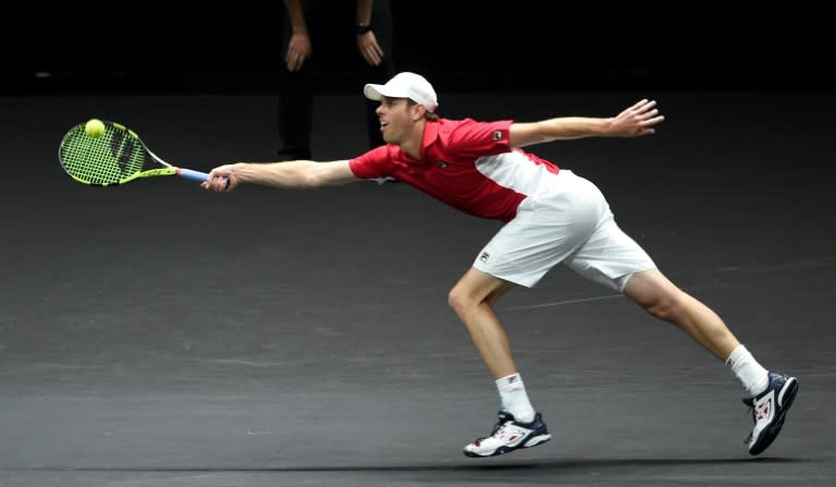 US Sam Querrey of Team World returns the ball to Swiss Roger Federer of Team Europe during second day of Laver Cup on September 23, 2017 in Prague