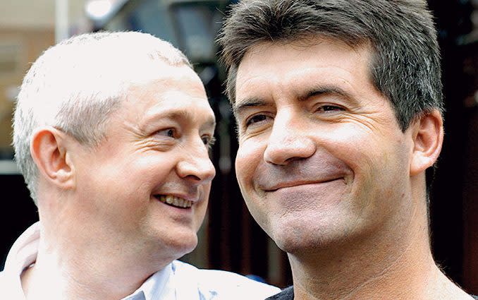 Cowell with fellow X Factor judge Louis Walsh - Getty Images 