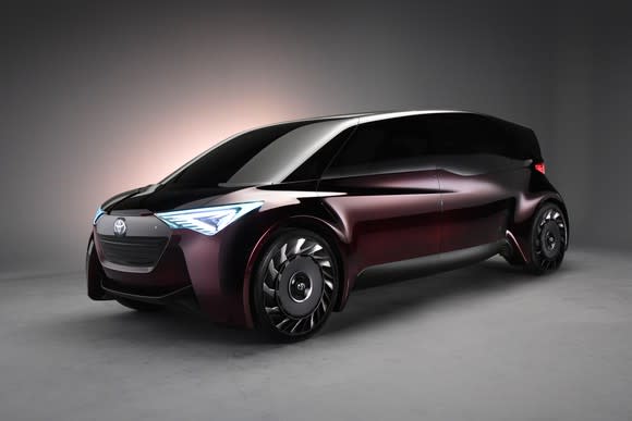 Toyota's Fine-Comfort Ride concept vehicle, a boxy purple four-door shaped somewhat like a minivan.