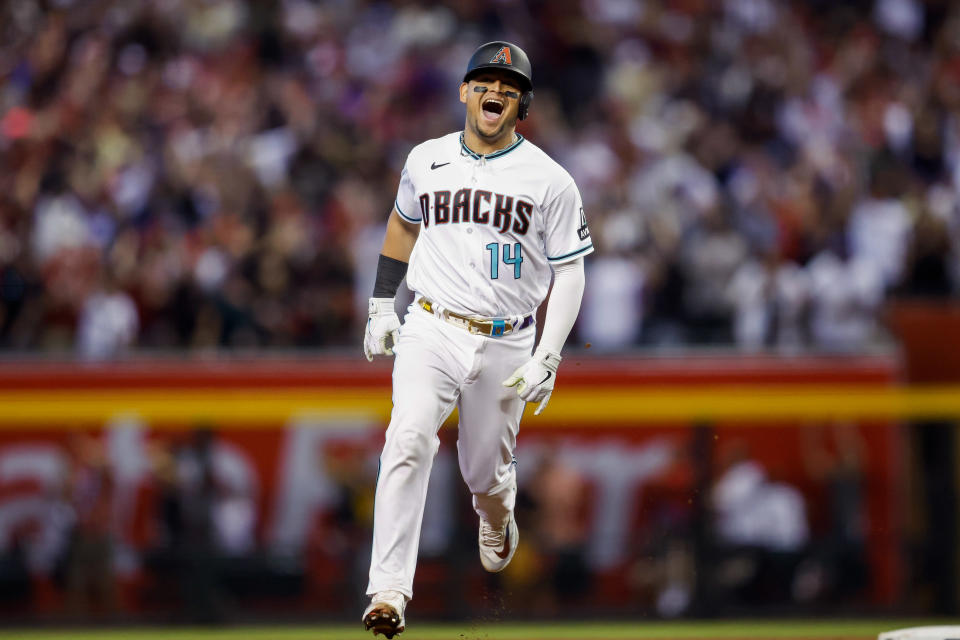 PHOENIX, AZ - OCTOBER 11:   Gabriel Moreno #14 of the Arizona Diamondbacks hits a solo home run after hitting a home run foul ball on the previous pitch in the third inning during Game 3 of the Division Series between the Los Angeles Dodgers and the Arizona Diamondbacks at Chase Field on Wednesday, October 11, 2023 in Phoenix, Arizona. (Photo by Chris Coduto/MLB Photos via Getty Images)