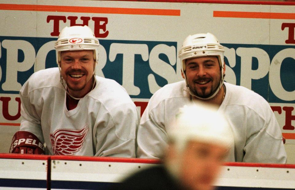 Detroit Red Wings' Kris Draper, left, and Martin Lapointe watch teammates take part in a short scrimmage during an abbreviated practice May 20, 1997 at Joe Louis Arena.