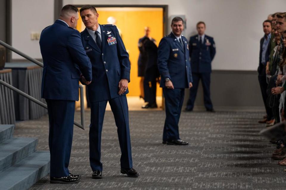 Col. Scott P. Weyermuller, incoming 2nd Bomb Wing commander, is congratulated by Col. Mark C. Dmytryszyn, outgoing 2nd Bomb Wing commander, during a change-of-command ceremony at Barksdale Air Force Base, Louisiana, March 31, 2022. Founded in 1947, the 2nd Bomb Wing is the largest bomb wing in Air Force Global Strike Command.
