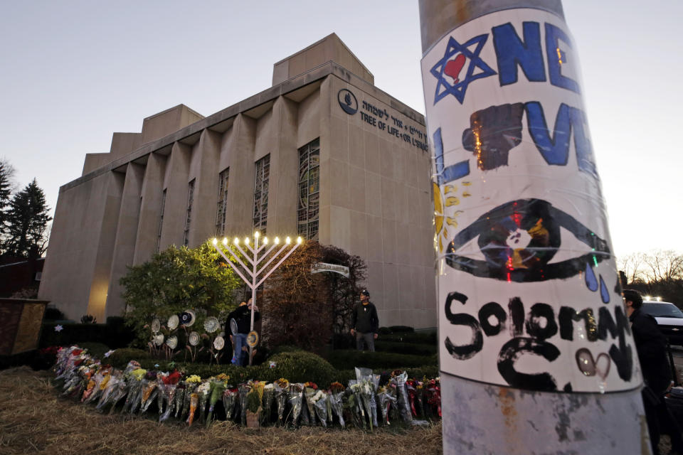 A menorah is tested outside the Tree of Life Synagogue in preparation for a celebration service at sundown on the first night of Hanukkah, Sunday, Dec. 2, 2018 in the Squirrel Hill neighborhood of Pittsburgh. A gunman shot and killed 11 people while they worshipped Saturday, Oct. 27, 2018 at the temple. (AP Photo/Gene J. Puskar)