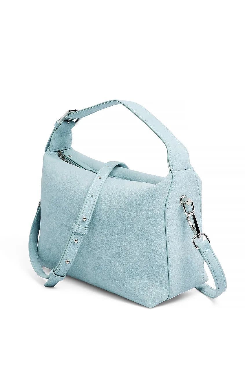 <p><a href="https://go.redirectingat.com?id=74968X1596630&url=https%3A%2F%2Fna-kd.com%2Fen%2Fproducts%2Fsoft-buckle-detail-bag-pale-blue-1100-009523-5530&sref=https%3A%2F%2Fwww.cosmopolitan.com%2Fstyle-beauty%2Ffashion%2Fa61546623%2Fhow-to-style-sweatpants%2F" rel="nofollow noopener" target="_blank" data-ylk="slk:Shop Now;elm:context_link;itc:0;sec:content-canvas" class="link rapid-noclick-resp">Shop Now</a></p><p>Soft Buckle Detail Bag</p><p>na-kd.com</p><p>$29.99</p>