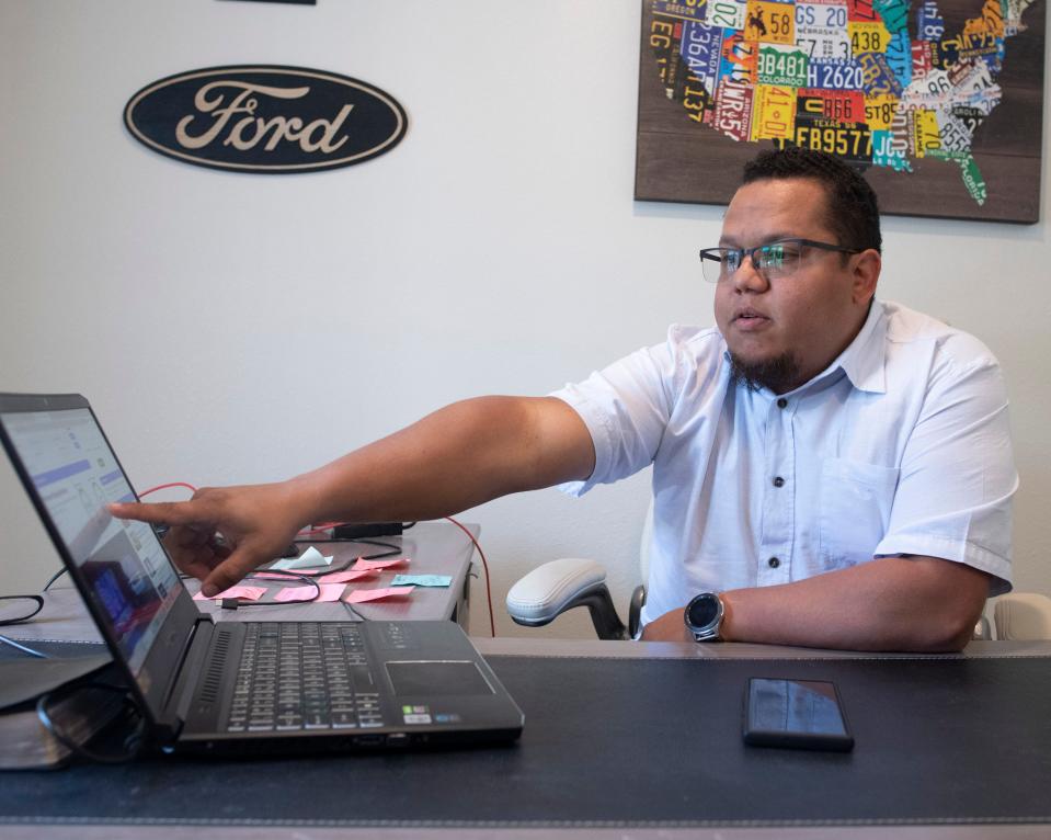 Antonio Estaba, the owner of Estaba Motors, reviews sales figures for his auto dealership on Wednesday, May 31, 2023. Estaba, who specializes in selling vehicles to Hispanic customers, has seen his sales drop since the passage of Senate Bill 1718, which declares the state will no longer recognize driver's licenses from other states that are issued to people living in the country illegally.