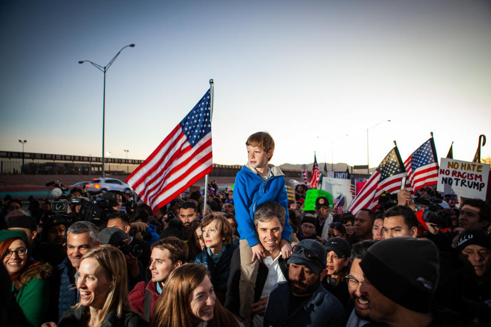 Beto O'Rourke carries his son Henry O'Rourke (8yrs) on his shoulder as they march along the US Mexico border in protest of Trumps wall February 11, 2019 in El Paso, Texas. (Photo: Christ Chavez/Getty Images)