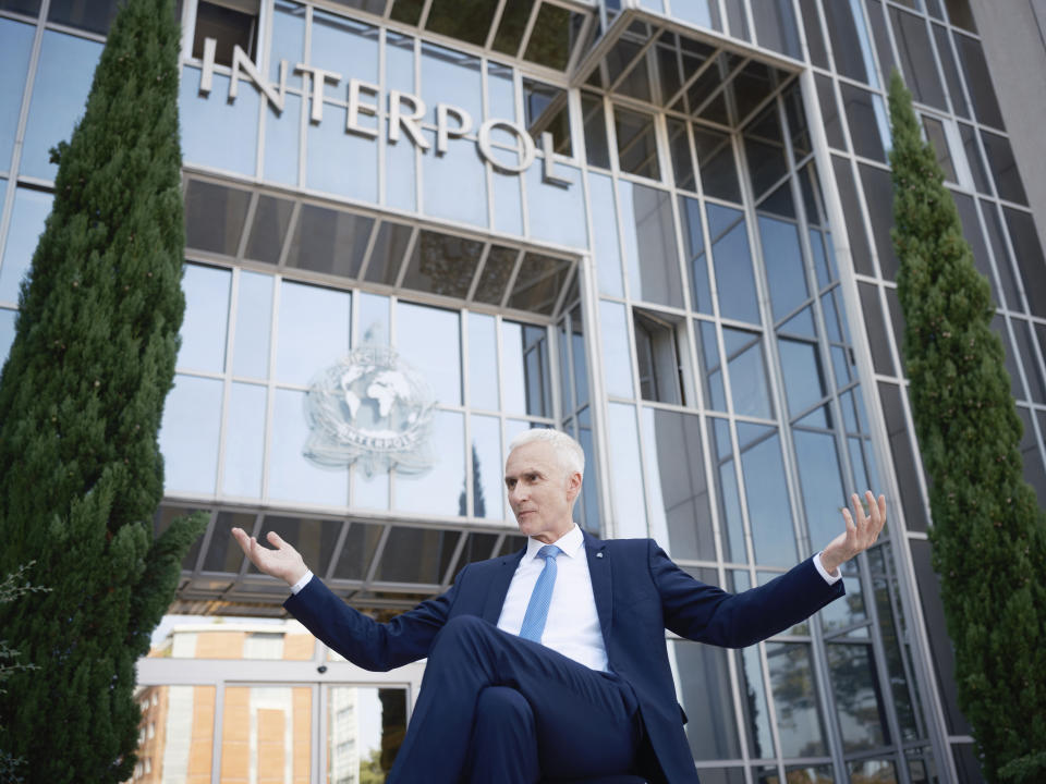 Interpol Secretary General Jurgen Stock talks to journalists during an interview outside the Interpol headquarters in Lyon, central France, Tuesday, Sept. 5, 2023. Jürgen Stock, who was appointed to the post in 2014 is beginning his last year in office. Interpol, which was founded in 1923, is celebrating its 100th anniversary this month. (AP Photo/Laurent Cipriani)