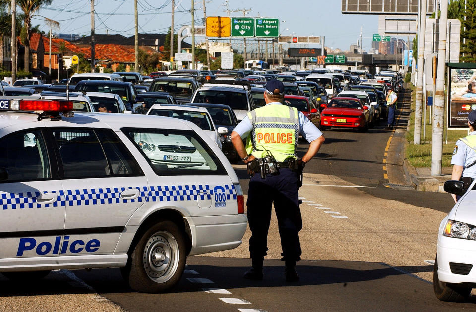 NSW Police block southbound traffic on The Grand Parade, diverting cars into Bestic St, Kyeemagh.