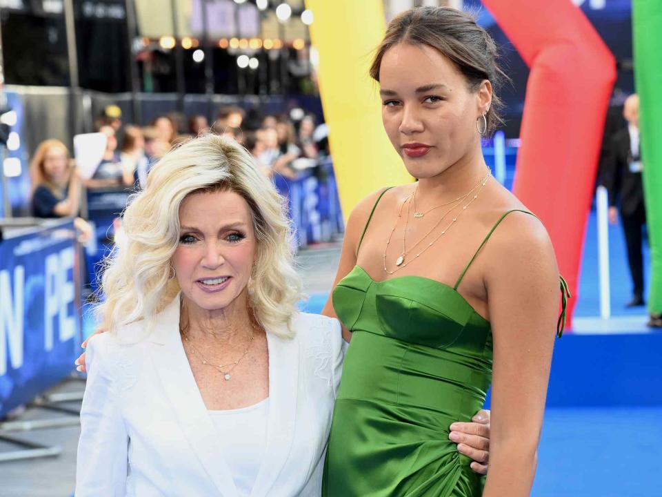 <p>Dave J Hogan/Getty</p> Donna Mills and daughter Chloe attend the UK Premiere Of "NOPE" on July 28, 2022 in London, England.