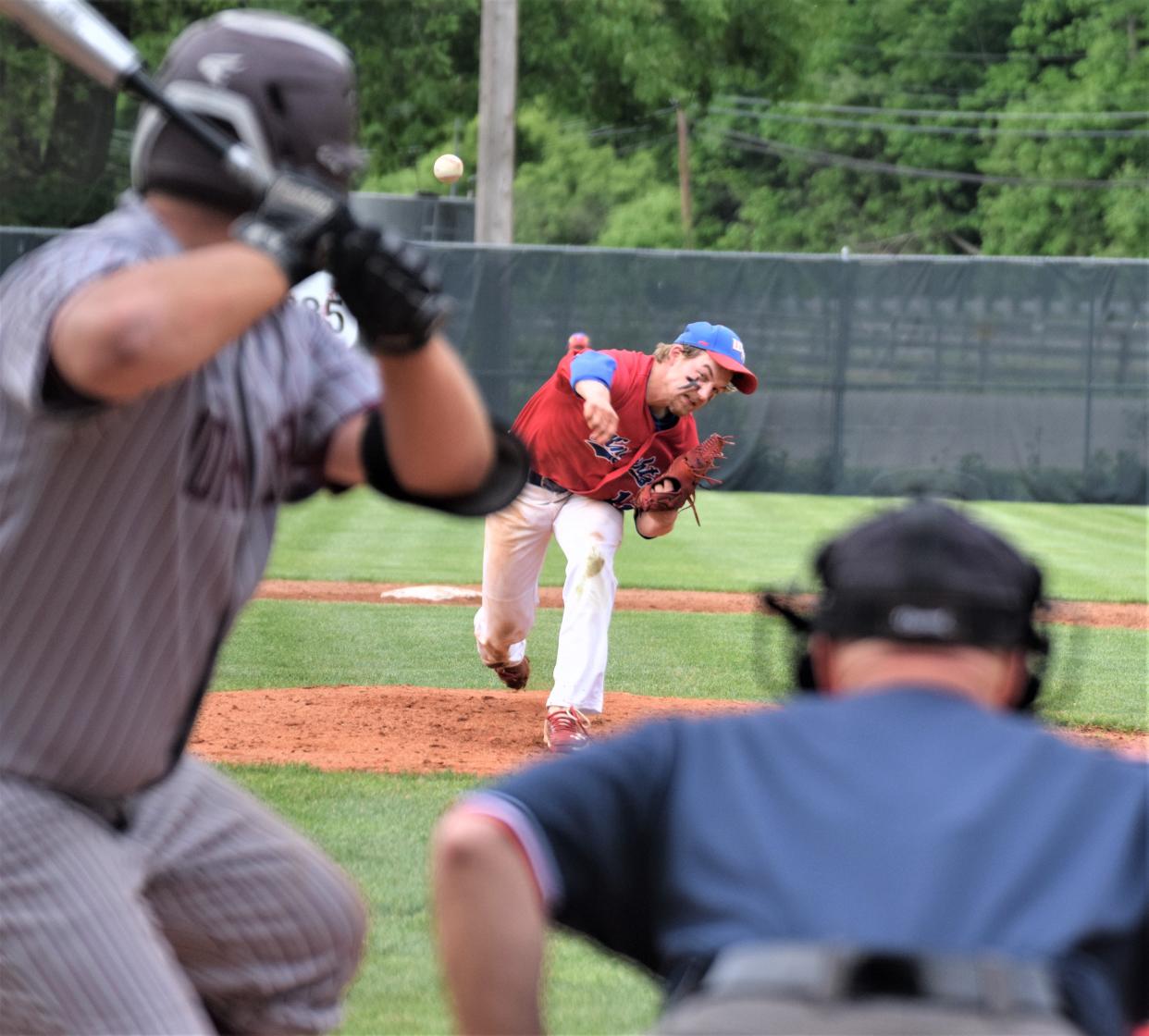 West Holmes senior Noah Clark delivers a breaking ball to John Glenn's Gunner Fox. The Knights' senior allowed one run on eight hits.