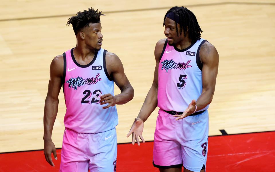 Miami Heat forward Jimmy Butler (22) and forward Precious Achiuwa (5) talk during the second quarter against the Houston Rocket at Toyota Center.