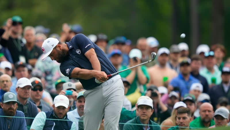 Jon Rahm, of Spain, hits on the 12th hole during a practice round in preparation for the Masters golf tournament at Augusta National Golf Club, Tuesday, April 9, 2024, in Augusta, Ga.