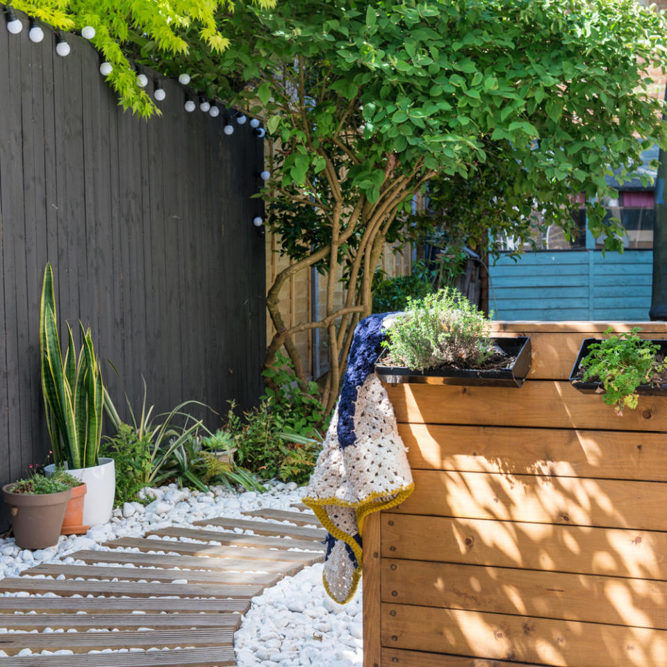 <p> Use decking to create a pathway through your garden – perhaps to a more solid decked area. This boardwalk-style garden path is given even more of a seaside feel with white pebbles, which help to keep weeds at bay. </p> <p> The wooden decks create a striking contrast to the white pebbles and makes stepping across them much easier; a must if you like walking around barefoot. </p>