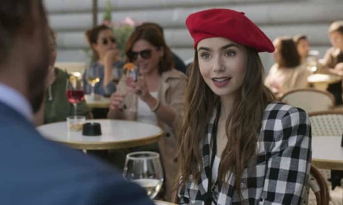 Lily Collins wearing a beret hat in "Emil in Paris."