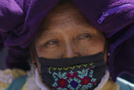 A relative of the one of the 43 students attends a protest outside of a military base in Mexico City, Friday, Sept. 23, 2022, days before the anniversary of the disappearance of the students in Iguala, Guerrero in 2014. One week prior, Mexican authorities said they arrested a retired general and three other members of the army for alleged connection to their disappearance. (AP Photo/Fernando Llano)