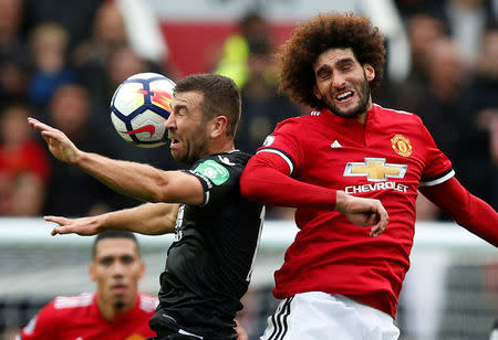 Soccer Football - Premier League - Manchester United vs Crystal Palace - Old Trafford, Manchester, Britain - September 30, 2017 Crystal Palace's James McArthur in action with Manchester United's Marouane Fellaini REUTERS/Andrew Yates