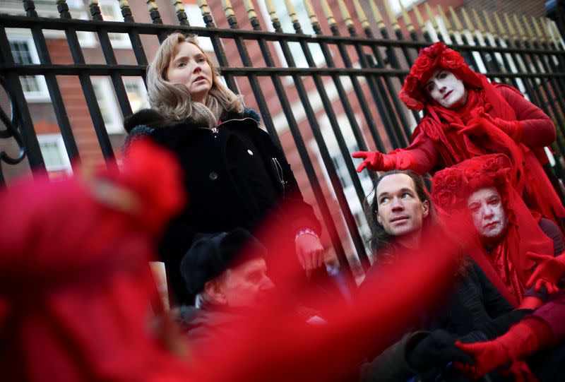 Model Lily Cole speaks to hunger strikers outside Conservative Campaign Headquarters in London