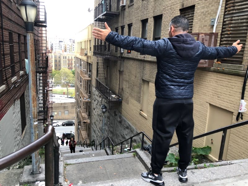 Patricio Osuna, a tourist from Tijuana Mexico, poses atop the "Joker steps" in the Bronx
