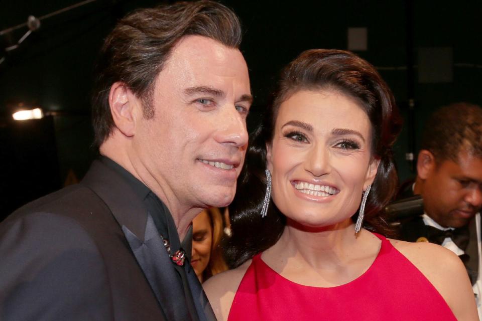 <p>Christopher Polk/Getty</p> John Travolta and Idina Menzel attend the 87th Annual Academy Awards in 2015