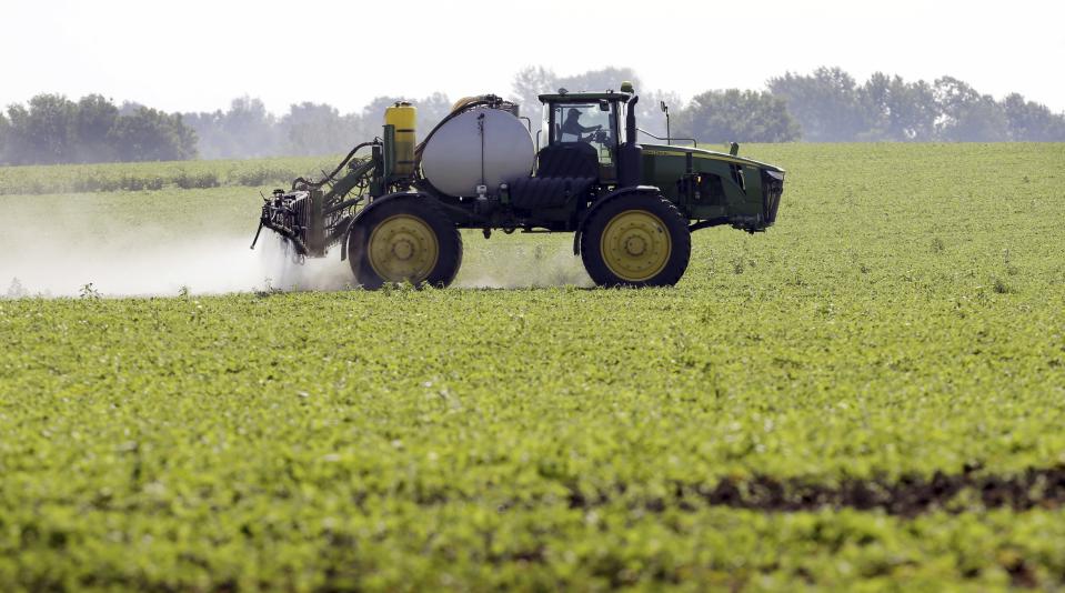 FILE - A soybean field is sprayed in Iowa, July 11, 2013. The maker of a popular weedkiller is turning to lawmakers in key states to try to squelch legal claims that it failed to warn about cancer risks. (AP Photo/Charlie Neibergall, File)