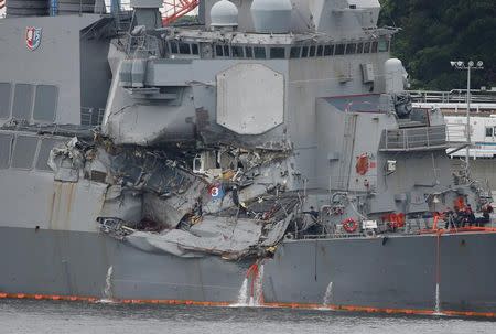 FILE PHOTO: The Arleigh Burke-class guided-missile destroyer USS Fitzgerald, damaged by colliding with a Philippine-flagged merchant vessel, is seen at the U.S. naval base in Yokosuka,, Japan June 18, 2017. REUTERS/Toru Hanai