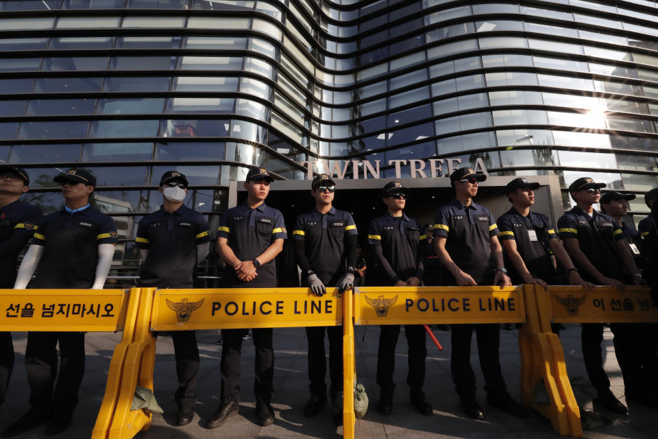 South Korean police officers stand guard in front of Japanese embassy as a rally demanding the South Korean government to abolish the General Security of Military Information Agreement, or GSOMIA, an intelligence-sharing agreement between South Korea and Japan, is held near the embassy, in Seoul, South Korea, Thursday, Aug. 22, 2019. (AP Photo/Lee Jin-man)