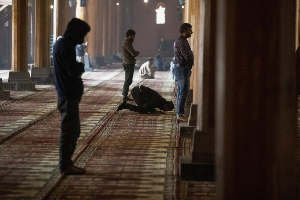 Kashmiri men offer prayer inside the Jamia Masjid, or the grand mosque in Srinagar, Indian controlled Kashmir, Nov. 13, 2021. The mosque has remained out of bounds to worshippers for prayers on Friday – the main day of worship in Islam. Indian authorities see it as a trouble spot, a nerve center for anti-India protests and clashes that challenge New Delhi’s sovereignty over disputed Kashmir. For Kashmiri Muslims it is a symbol of faith, a sacred place where they offer not just mandatory Friday prayers but also raise their voice for political rights. (AP Photo/Mukhtar Khan)