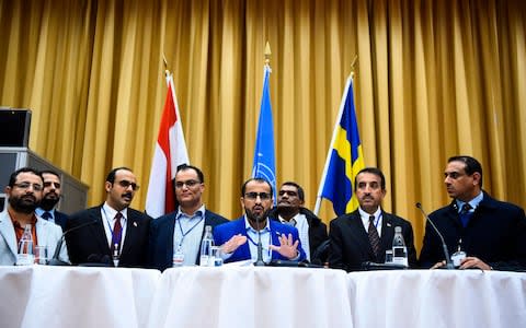 Rebel negotiator Mohammed Abdelsalam (C) holds a press conference together with members of the delegation following the peace consultations in Sweden - Credit: AFP