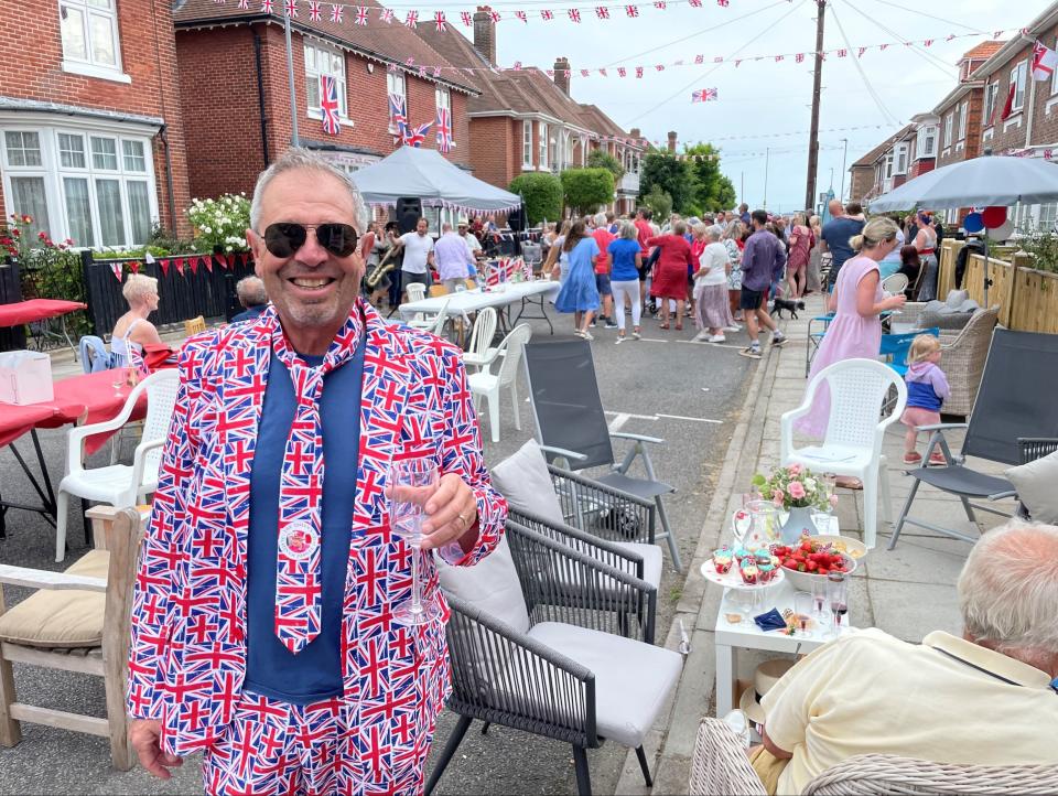 Paul Woolf, chief executive of the Kings Theatre, Southsea, enjoying a street party in Southsea, Hampshire (PA)