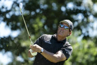 Phil Mickelson watches his shot off the 11th tee during the first round of the Travelers Championship golf tournament at TPC River Highlands, Thursday, June 24, 2021, in Cromwell, Conn. (AP Photo/John Minchillo)