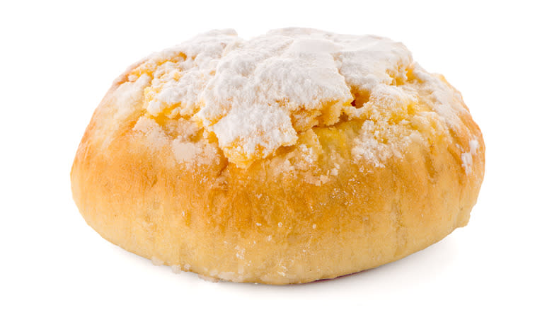 Puffy bread topped with powdered sugar 