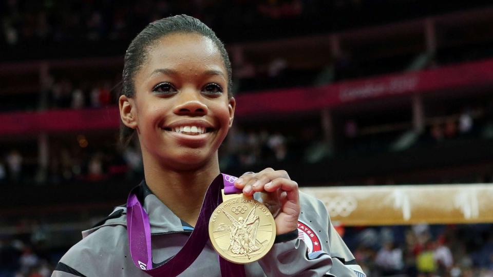 PHOTO: In this Aug. 2, 2012, file photo, Gabrielle Douglas of the United States celebrates after winning the gold medal in the Artistic Gymnastics Women's Individual All-Around final on Day 6 of the 2012 Olympic Games in London. (Ronald Martinez/Getty Images, FILE)