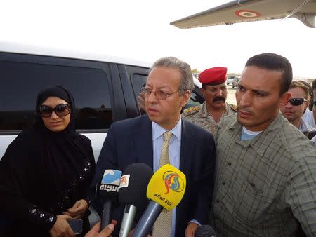 United Nation's special envoy to Yemen, Jamal Benomar (C), speaks to reporters as he boards a military plane in Saada, a stronghold of the Shi'ite Houthi group, September 19, 2014. REUTERS/Naiyf Rahma