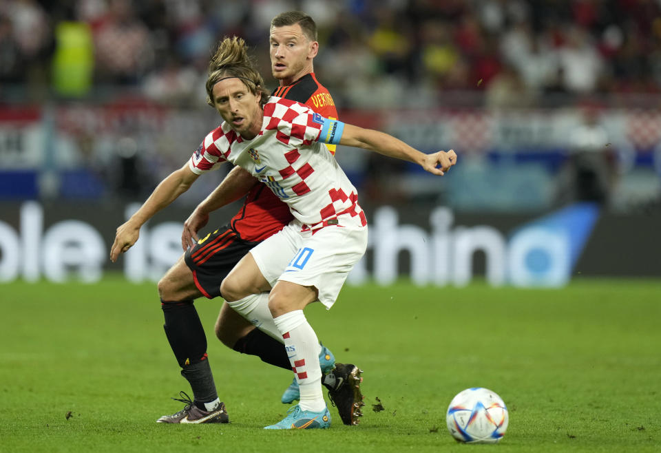 Croatia's Luka Modric, front, duels for the ball with Belgium's Jan Vertonghen during the World Cup group F soccer match between Croatia and Belgium at the Ahmad Bin Ali Stadium in Al Rayyan, Qatar, Thursday, Dec. 1, 2022. (AP Photo/Francisco Seco)