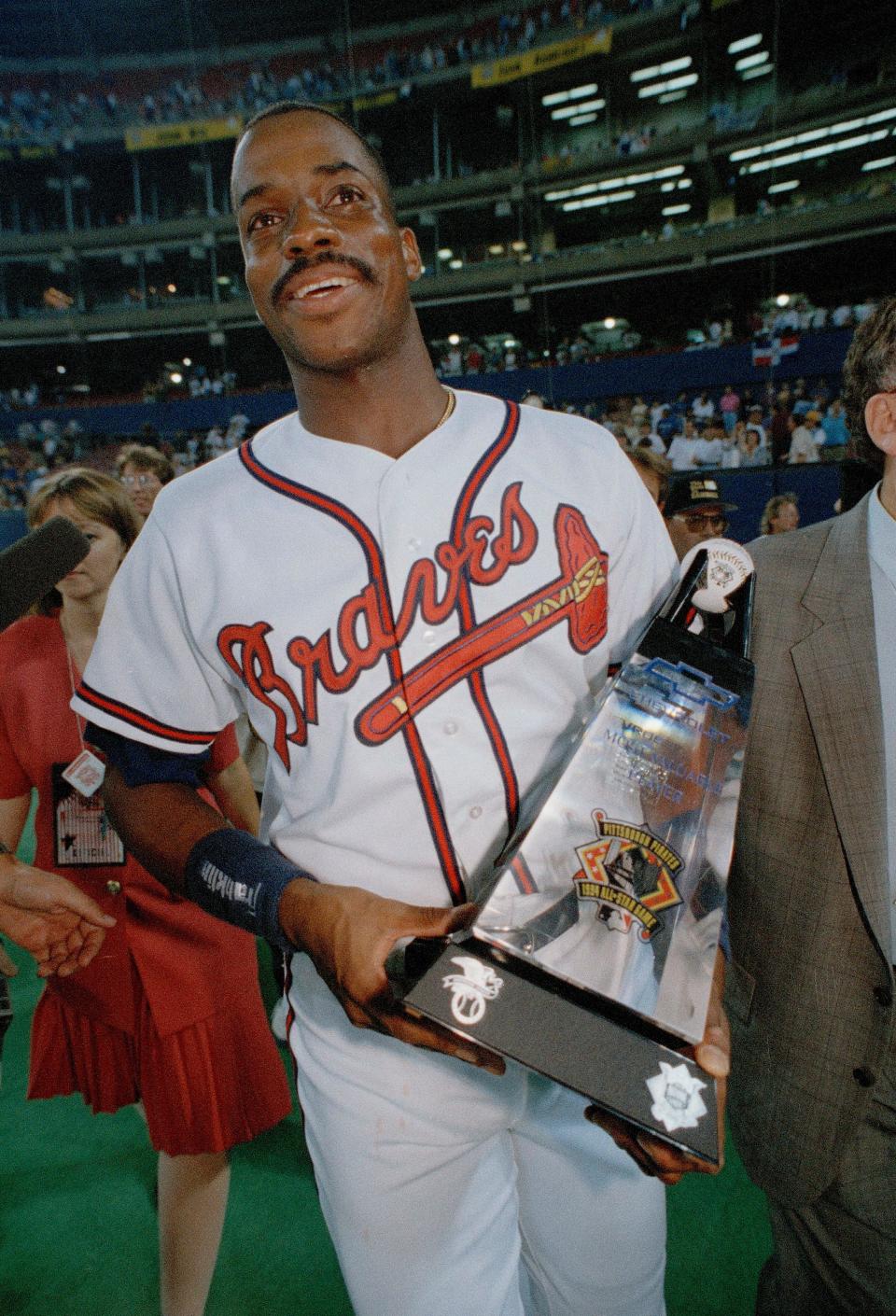 Braves first baseman Fred McGriff poses with the Most Valuable Player award after the 65th All Star Game at Three Rivers Stadium in Pittsburgh, July 12, 1994.