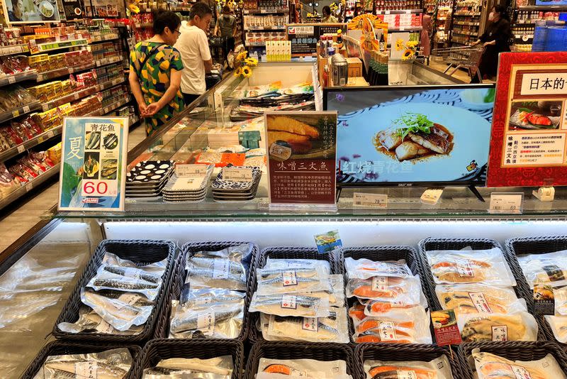 Packs of marinated fish are pictured in a freezer at a Japanese supermarket, in Beijing
