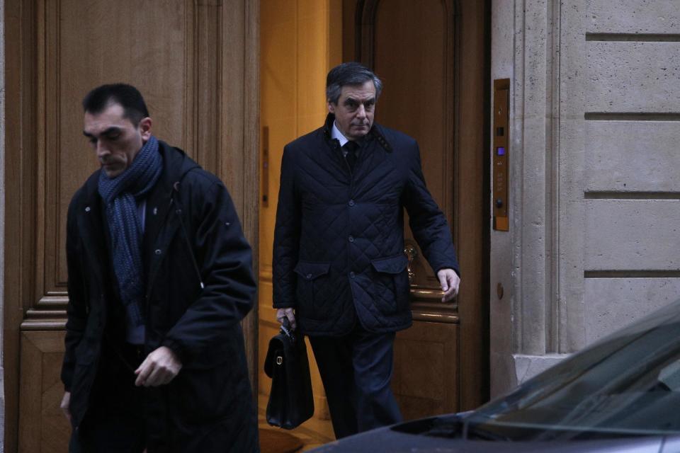 Conservative presidential candidate Francois Fillon leaves his home in Paris, Thursday, Feb. 2, 2017. Fillon has been under a preliminary probe since news reports said he paid his wife Penelope and two of the couple's children nearly one million dollars from public funds over the years for allegedly fake jobs as his parliamentary aides. (AP Photo/Thibault Camus)