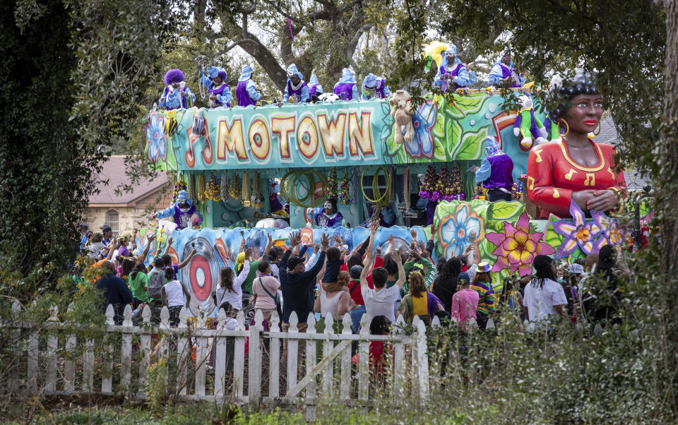 The Krewe of NOMTOC rolls through Algiers in New Orleans, Saturday, Feb. 10, 2024. (David Grunfeld/The Times-Picayune/The New Orleans Advocate via AP)
