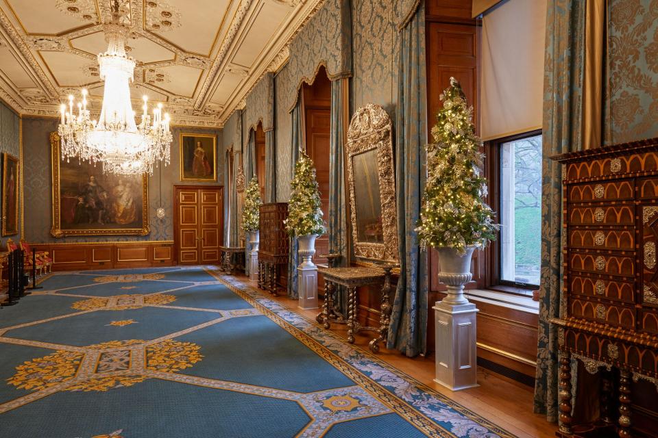 <p>Several smaller Christmas trees line the Queen's Gallery at Windsor Castle</p>PA