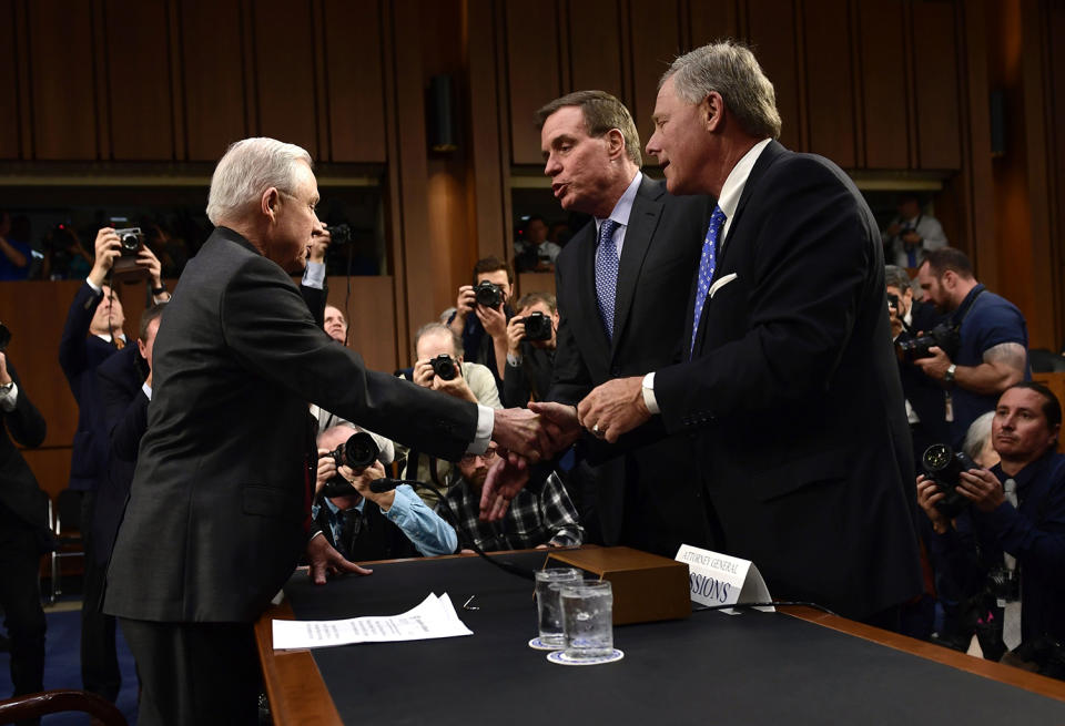 <p>Attorney General Jeff Sessions(L) shakes hands with Sen. Richard Burr(R) Intelligence Committee Chairman and Sen. Mark Warner (C) as he arrives to testify during a US Senate Select Committee on Intelligence hearing on Capitol Hill in Washington, D.C. on June 13, 2017. (Photo: Brendan Smialowski/AFP/Getty Images) </p>