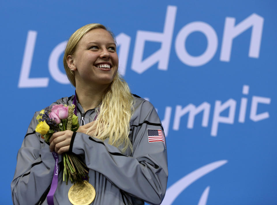 FILE - In this Saturday, Sept. 1, 2012 file photo, Jessica Long of the United States poses with her gold medal during the medal ceremony for the women's 100-meter breaststroke SB7 at the 2012 Paralympics game in London. NBC will air coverage of the Paralympics for the first time in primetime later this summer when the Summer Paralympic Games take place in Tokyo. NBCUniversal announced on Wednesday, Feb. 24, 2021 that 1,200 hours of programming will air across NBC's linear and digital channels. (AP Photo/Alastair Grant, File)