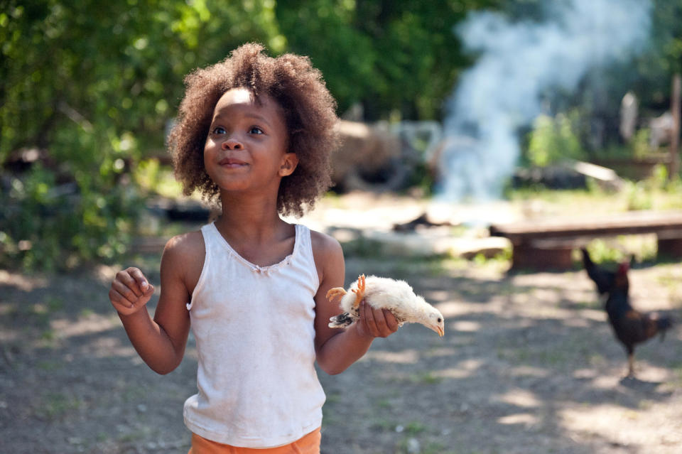 Quvenzhane Wallis holds a bird in her hand