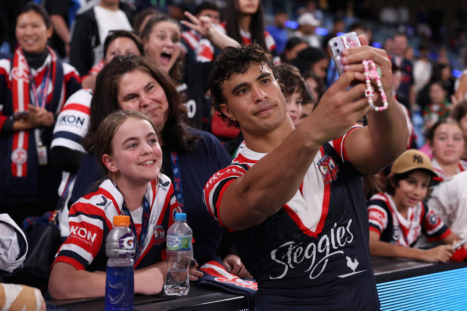 SYDNEY, AUSTRALIA - MARCH 22: Joseph-Aukuso Suaalii of the Roosters poses with fans following the round three NRL match between Sydney Roosters and South Sydney Rabbitohs at Allianz Stadium, on March 22, 2024, in Sydney, Australia. (Photo by Cameron Spencer/Getty Images)