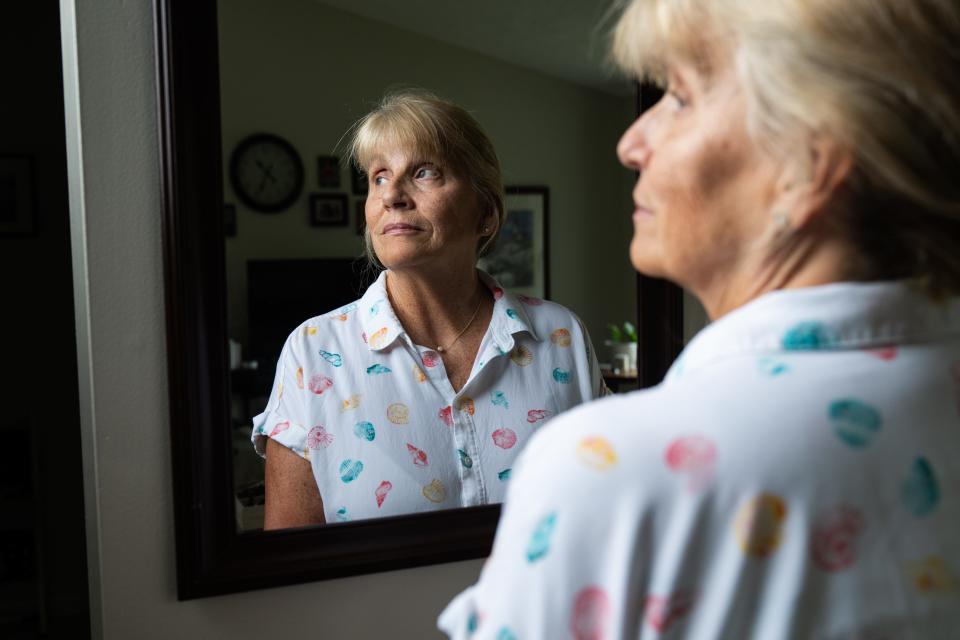 Jackie Duda, in a portrait at her home in New Market, Maryland, on July 12, 2024, is leaning on credit to help pay her dental bills.