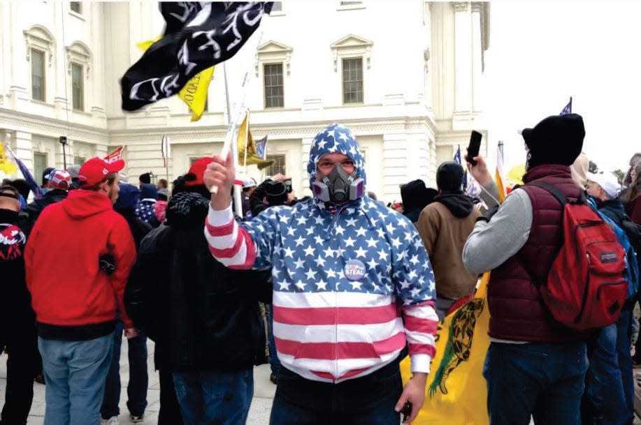 Carlos Ayala of Salisbury, Maryland is charged with civil disorder, a felony, and more for his role in the Jan. 6 Capitol riot. Ayala on the Upper West Terrace.