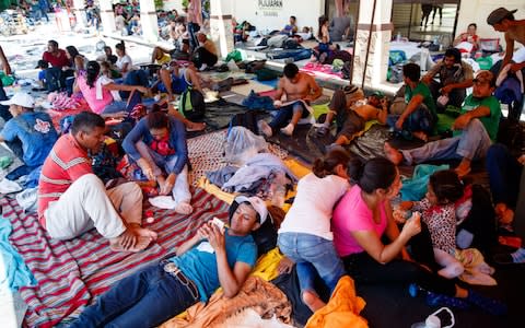 The migrants, mostly from Honduras, reached the town of Pijijiapan on Thursday where they set up camp with a makeshift assortment of plastic sheets for shade and shelter - Credit: James Breeden/Daily Telegraph